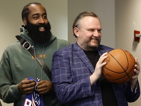 James Harden (left) and president of basketball operations Daryl Morey of the Philadelphia 76ers look on during a press conference.