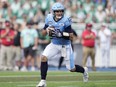 Toronto Argonauts quarterback Chad Kelly runs with the ball during CFL action against the Saskatchewan Roughriders.