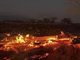 A wildfire burns in Kihei, Hawaii late Wednesday, Aug. 9, 2023. Thousands of residents raced to escape homes on Maui as blazes swept across the island, destroying parts of a centuries-old town in one of the deadliest U.S. wildfires in recent years.