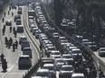 Vehicles are caught in a congestion during a rush hour in Jakarta, Indonesia, Thursday, Sept. 9, 2021. Indonesian authorities are blaming the dry season and and motorized vehicles as the main causes of air pollution in Jakarta, after a Swiss air quality technology company named the city as the most polluted in the world.