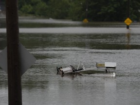 The top of a service truck is seen abandoned in floodwater following a major rain event in Halifax on Saturday, July 22, 2023.