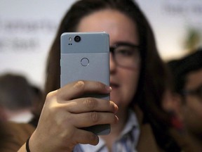 Ontario Provincial Police say they have identified the cause of a problem with the province's Amber Alert system after many cell phones did not receive an alert about a baby girl believed to be abducted on Thursday morning. A woman looks at a Google Pixel 2 phone at a Google event at the SFJAZZ Center in San Francisco, Oct. 4, 2017.
