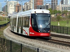 A file photo of an LRT car on a curved section of the Confederation Line in Ottawa.