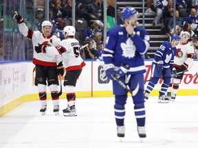 Ottawa Senators defenceman Jakob Chychrun (6) celebrates his game-winning goal alongside left winger Angus Crookshank (59) during overtime in preseason NHL hockey against the Toronto Maple Leafs.