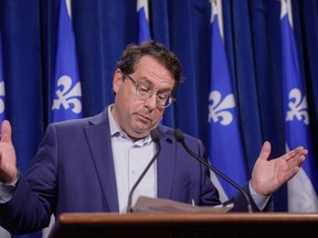 Quebec Minister of Education Bernard Drainville gestures as he speaks to the media on Wednesday, August 23, 2023, at the legislature in Quebec City. THE CANADIAN PRESS/Francis Vachon.