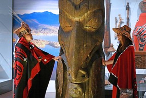Amy Parent, right, is shown with the Ni'isjoohl memorial pole alongside Nisga'a Chief Earl Stephens during a visit to the National Museum of Scotland in this handout image provided by National Museums Scotland. Parent says the pole is set to begin its month-long journey home to the Nisga'a Nation in northwestern British Columbia.
