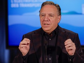 Quebec Premier Francois Legault gestures during a press conference at the opening of the Coalition Avenir Quebec caucus in Saguenay on Thursday Sept. 7, 2023.