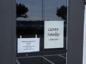 A sign at the Yarmouth Waterfront Gallery indicates it will be closed in anticipation of Hurricane Lee in Yarmouth, N.S. on Friday, Sept. 15, 2023.