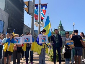 People gathered in support of Ukraine near Parliament Hill Friday, in hopes of seeing Ukraine's President Volodymyr Zelenskyy, who was to address the House. Bruce Deachman photo/