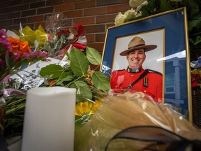 A memorial for officer Rick O'Brien, in front of the Ridge Meadows detachment in Maple Ridge B.C., on Saturday, September 23, 2023. O'Brien was shot and killed while executing a warrant in Coquitlam on Friday.