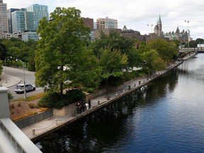 Ottawa police investigate a dead body in the Rideau Canal near Mackenzie King Bridge in Ottawa Wednesday.