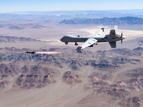 An MQ-9 Reaper remotely piloted drone aircraft fires a Hellfire missile during testing on Aug. 30 in the United States.