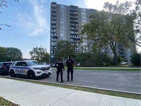 Police at standoff Thursday morning with a man barricaded in a sixth floor apartment on Heatherington Road.