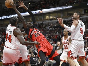 Toronto Raptors forward Chris Boucher (25) grabs a rebound