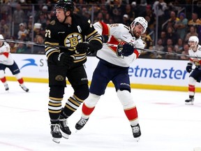 Boston Bruins Charlie McAvoy illegally checks Florida Panthers Oliver Ekman-Larsson