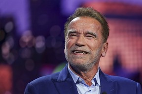 Arnold Schwarzenegger talks during a pre-show BMW keynote at CES 2023, Jan. 4, 2023, in Las Vegas.