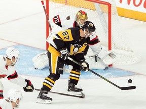 Pittsburgh Penguins' Sidney Crosby is stopped by Ottawa Senators goaltender Joonas Korpisalo