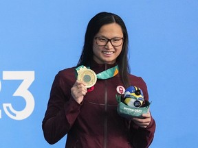 Canadian swimmer Maggie Mac Neil picked up her third gold medal of the 2023 Pan Am Games with a victory in the women's 100-metre freestyle on Monday.&ampnbsp;Mac Neil holds her gold medal in the Women's 100m Butterfly finals and sets a new Pan American record during the Santiago 2023 Pan American Games, in Santiago, Chile, Sunday, Oct. 22, 2023.