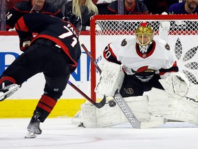 Ottawa Senators goaltender Joonas Korpisalo blocks the penalty shot attempt by the Carolina Hurricanes' Jesper Fast during the first period in Raleigh, N.C., Wednesday, Oct. 11, 2023.
