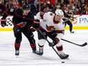 The Ottawa Senators' Vladimir Tarasenko controls the puck in front of the Carolina Hurricanes' Martin Necas during the first period in Raleigh, N.C., Wednesday, Oct. 11, 2023.