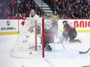 Los Angeles Kings right winger Carl Grundstrom (left) scores on Ottawa Senators goaltender Joonas Korpisalo.