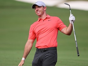 Rory McIlroy of Northern Ireland reacts following his second shot on the eighth hole during Day One of the DP World Tour Championship.