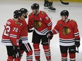 Chicago Blackhawks' Corey Perry (94) celebrates with teammates.