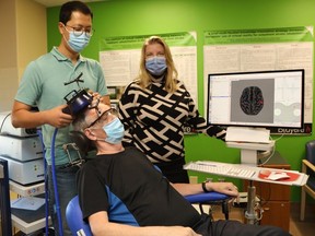 Dr. Jodi Edwards, Dr Donguk Jo (left) and patient Gordon Bryant.