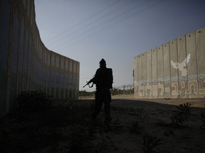 An Israeli soldier stands amid protective barriers