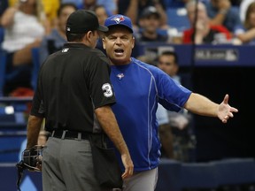 Manager John Gibbons of the Toronto Blue Jays has a discussion with home plate umpire Pat Hoberg after being ejected.