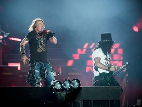Axl Rose (left), lead singer of rock band Guns N' Roses, performs with Slash at Parken Stadium in Copenhagen, Denmark, June 27, 2017.