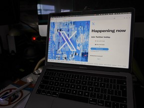A view of a laptop shows the Twitter sign-in page with their the new logo
