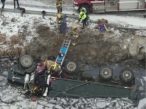 A photo from overhead shows the partially-submerged dump truck whose driver was trapped in the chilly water for more than an hour on Tuesday.