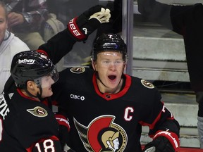 Ottawa Senators' Brady Tkachuk (right) celebrates his goal with teammate Tim Stutzle