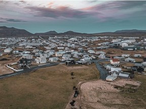 This image taken with a drone shows the town of Grindavik, Iceland, Thursday, Nov. 16, 2023. Residents of a fishing town in southwestern Iceland have left their homes after increasing concern about a potential volcanic eruption caused civil defense authorities to declare a state of emergency in the region. Iceland's Meteorological Office says police decided to evacuate Grindavik after recent seismic activity in the area moved south toward the town.
