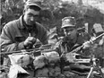 Two members of Quebec's Royal 22nd Regiment, also known as the Van Doos, prepare for a patrol during the Korean War.