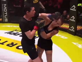 Screengrab of Gosia Magical, left, punching Nikita Aolkin in MMA fight in Poland.