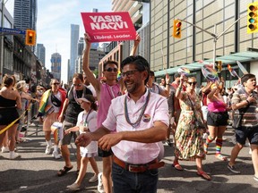 Ontario Liberal leadership candidate and Ottawa Centre MP Yasir Naqvi walks in the Toronto Pride Parade, on Sunday June 25, 2023. Two contenders for the Ontario Liberal leadership are banding together to urge their supporters to put the other as a second choice.