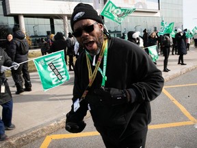 Steve Cassell shouts out slogans while on the picket line outside McGill University Health Centre Nov. 21, 2023.
