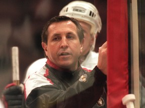 Senators coach Jacques Martin draws plays at a practice during his first stint with the team.