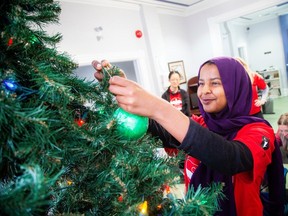 Olaa Fadlalla was part of a small group of Carleton University students came together Saturday to volunteer at the Mission to decorate a Christmas tree to bring some holiday cheer.