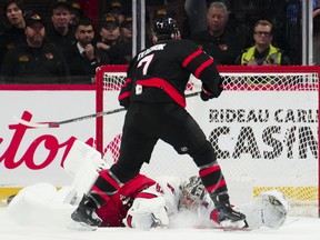 Carolina Hurricanes goaltender Pyotr Kochetkov makes a save on Ottawa Senators winger Brady Tkachuk on a penalty shot.