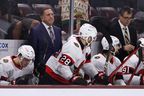 Interim head coach Jacques Martin of the Ottawa Senators watches from the bench against the Arizona Coyotes.