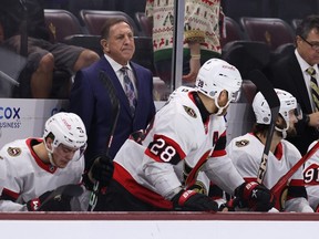 Interim head coach Jacques Martin of the Ottawa Senators watches from the bench against the Arizona Coyotes.