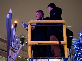 Mayor Mark Sutcliffe prepares to light the 12-foot menorah at Ottawa City Hall
