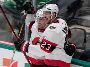 Travis Hamonic, seen celebrating a goal with Alex DeBrincat in December 2022,