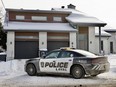 A Laval police car is parked outside the home of Davide (Baldy) Barberio on Thursday, Dec. 7, 2023.