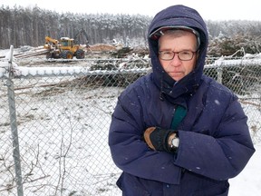 Mike Vorobej, a spokesperson for Save the Hunt Club Forest community group, stands in front of the area where tree-cutting continued on Thursday.