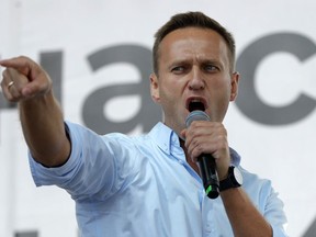 FILE - Russian opposition activist Alexei Navalny gestures while speaking to a crowd during a political protest in Moscow, Russia on July 20, 2019. Associates of imprisoned Russian opposition leader Alexei Navalny say he has been located at a prison colony above the Arctic Circle nearly three weeks after contact with him was lost. Navalny, the most prominent foe of Russian President Vladimir Putin, is serving a 19-year sentence on charges of extremism.