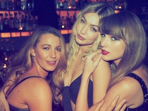 Taylor Swift is pictured celebrating her birthday with Gigi Hadid and Blake Lively in a photo posted on her Instagram account.